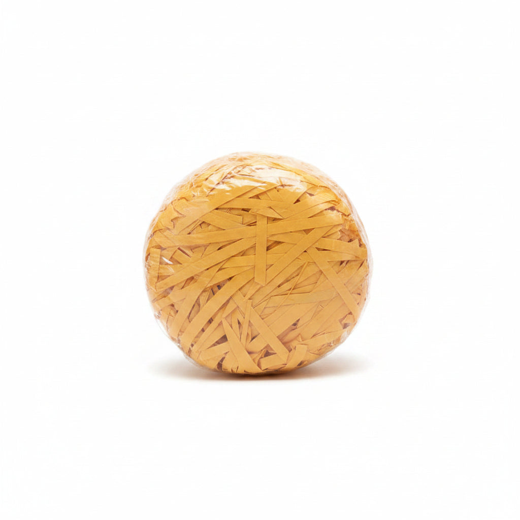 Golden yellow mustard shredded paper gift box filler in a clear bag