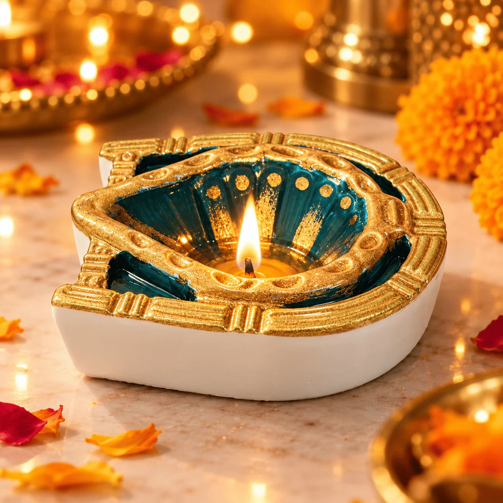 Finished-project reference showing a teal and gold ornate diya with a lit wick; finished diya not included
