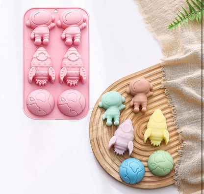 Bloom Creations Silicone Space Theme Mould, 6-Cavity Astronaut Rocket Planet Shapes for Chocolate Candy Soap Making, Food Grade Pink Baking Tray, Microwave Freezer Dishwasher Safe Kitchen Tool