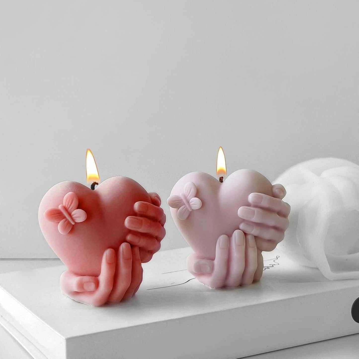 Hands Holding Heart Silicone Mould — finished candle | Bloom Creations India