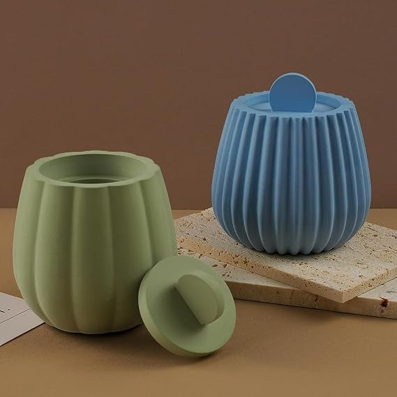 Ribbed lidded candle jar mould lifestyle shot showing green and blue finished candles