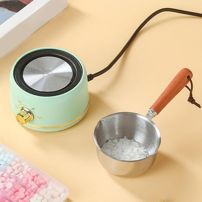 Top view of wax melting heater with wax beads in pot