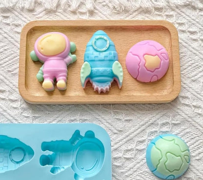 Bloom Creations Silicone Space Theme Mould, 6-Cavity Astronaut Rocket Planet Shapes for Chocolate Candy Soap Making, Food Grade Pink Baking Tray, Microwave Freezer Dishwasher Safe Kitchen Tool