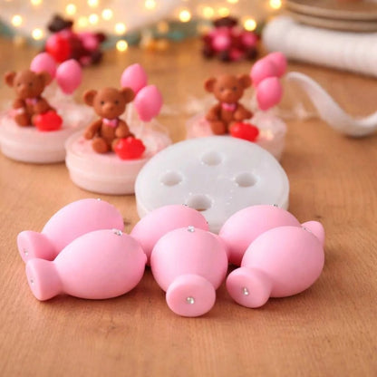 Pink balloon silicone mould showing 7 cavities with mixed sizes