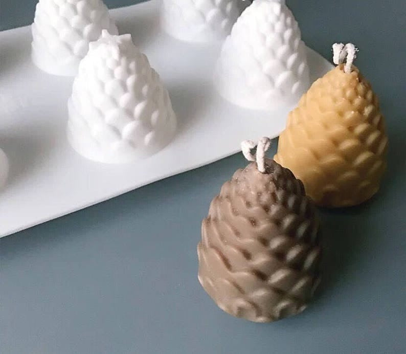 8-cavity pinecone tree silicone mold — finished candle example