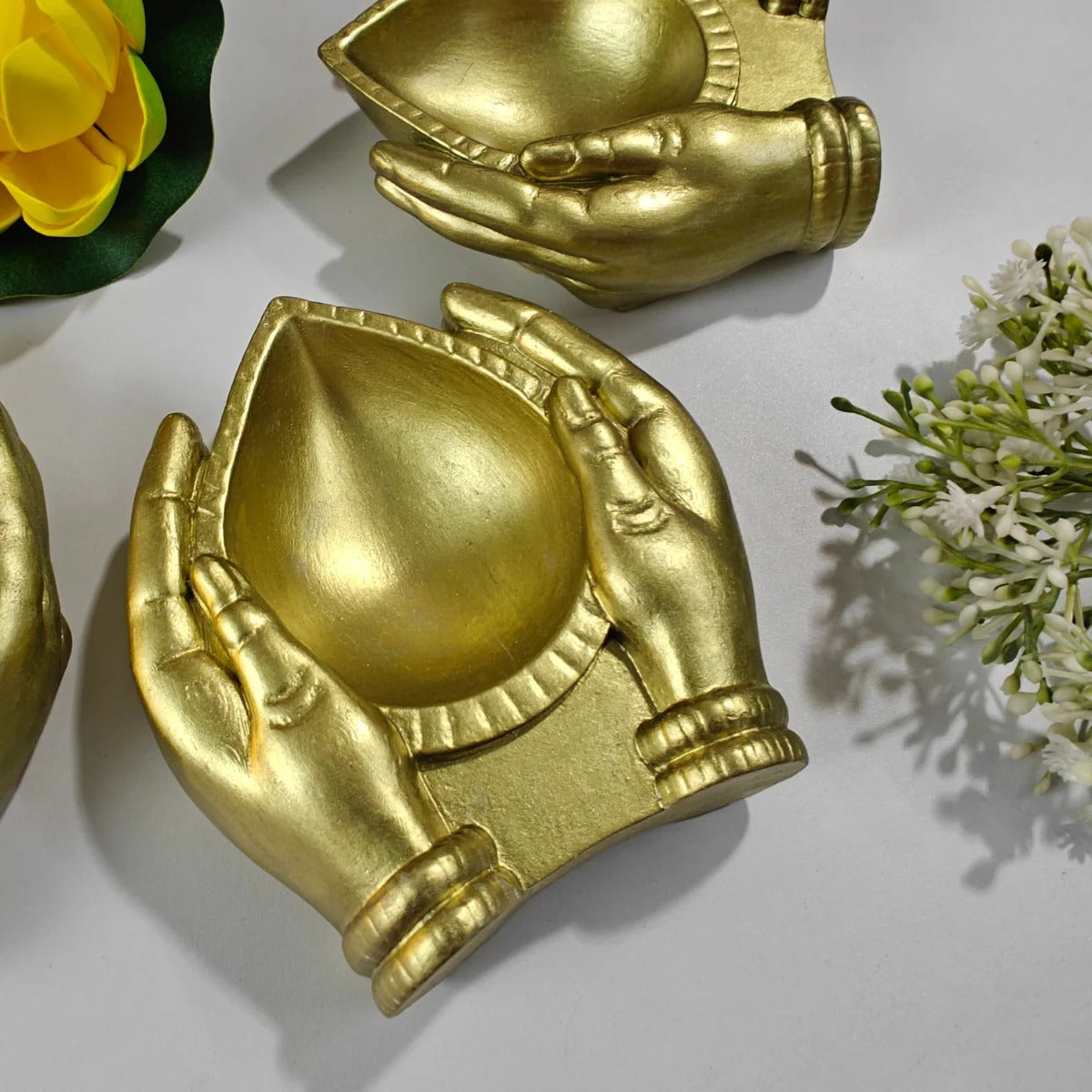 Arpan Diya Mould – gold finished candle holder close-up detail