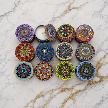 12 round mandala candle tins with vibrant boho decorative lids displayed on marble surface, one tin open showing candle and wick