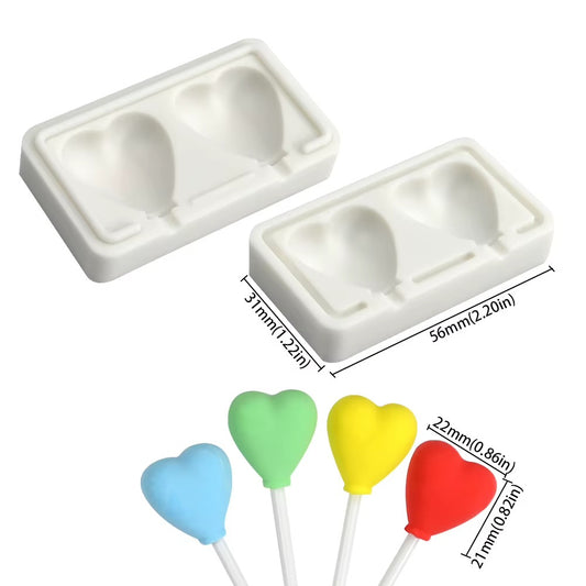 Mini two-cavity heart lollipop mould size chart showing 56 × 31 mm tray and 22 × 21 mm sample hearts
