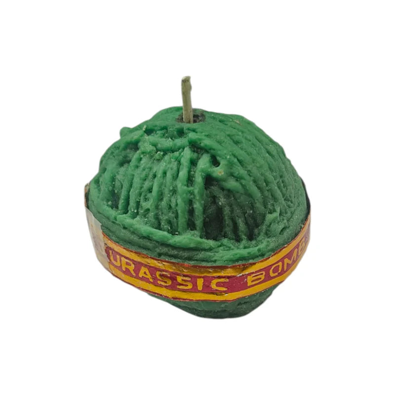 Sutli Bomb Firecracker Candle – top-down view showing rope-texture surface and wick in dark green wax