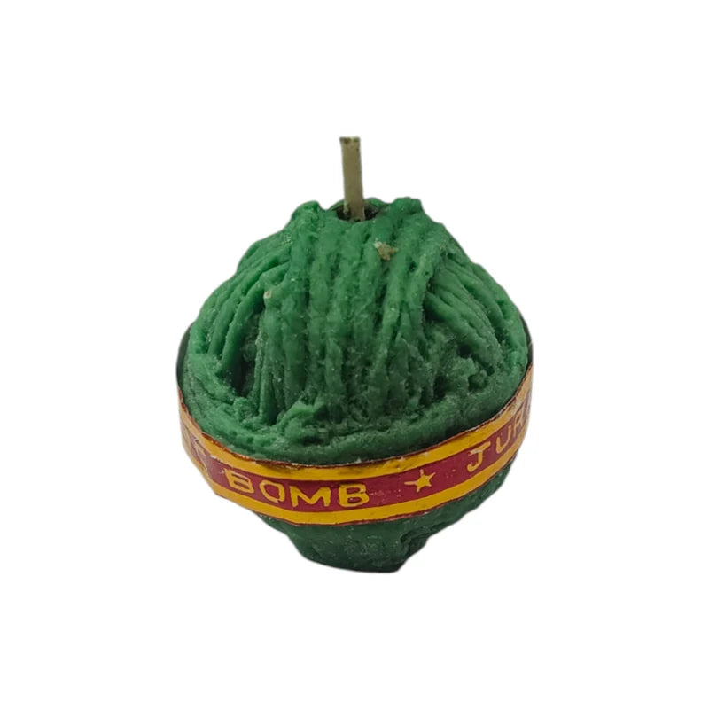 Sutli Bomb Firecracker Candle – side angle showing Jurassic Bomb label band and rope texture in dark green wax