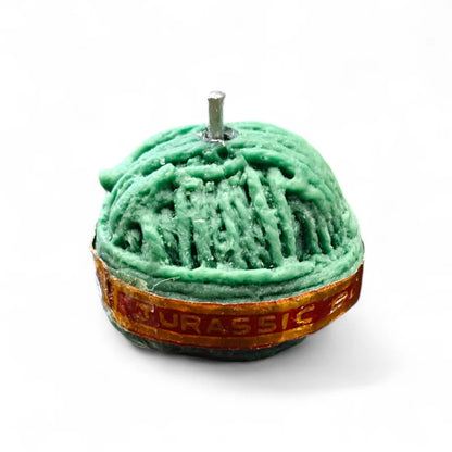 Sutli Bomb Firecracker Candle – side view showing Jurassic Bomb label and dome rope texture in dark green wax