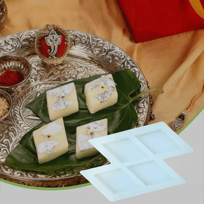 4-cavity diamond silicone barfi mould with freshly made barfi on a festive silver thali