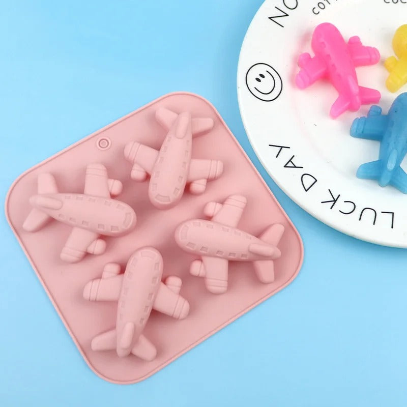 Airplane mould with dimensions and finished blue airplane figurines