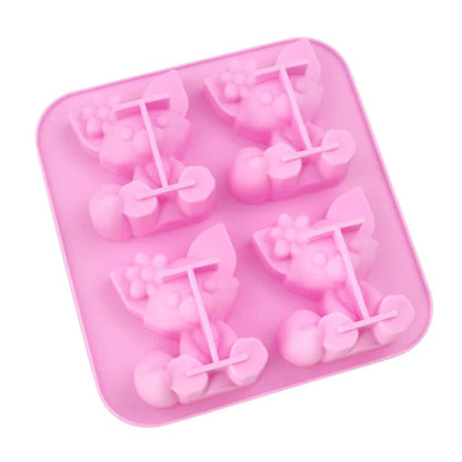 Close-up of pink 4-cavity cat silicone mould showing detailed 3D cat cavities