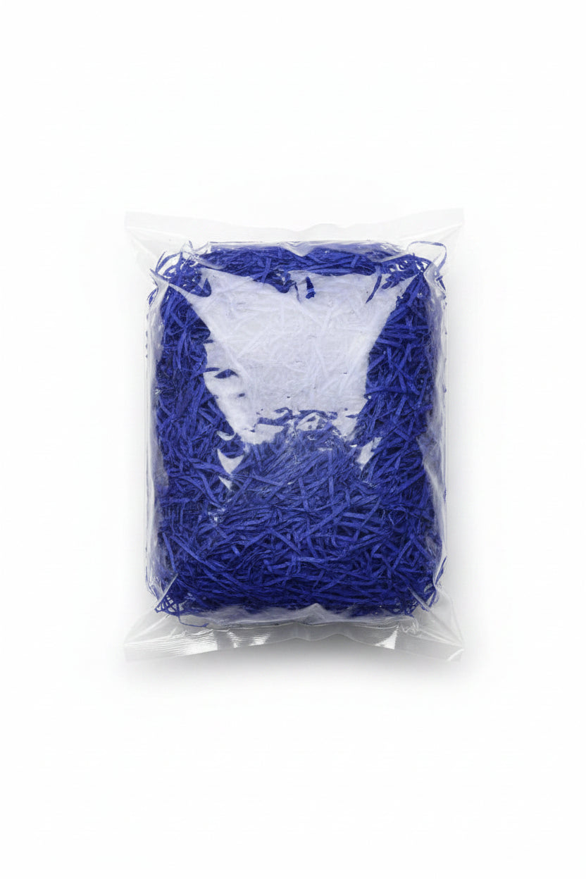 Blue shredded paper gift box filler in a clear bag