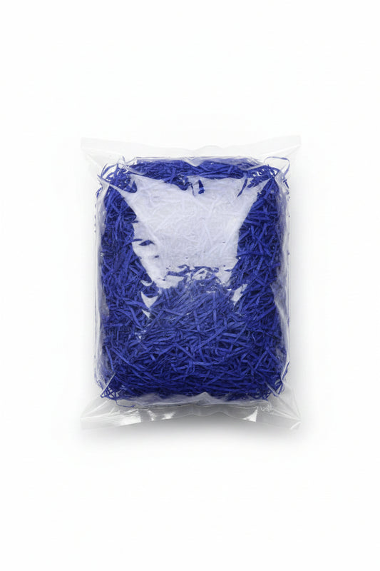 Blue shredded paper gift box filler in a clear bag