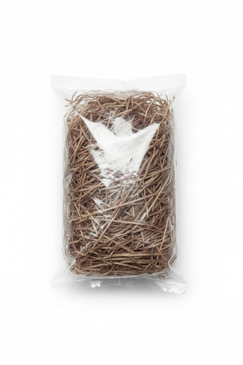 Natural brown shredded wooden gift box filler in a clear bag