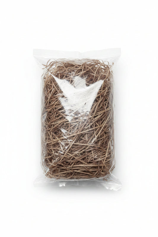 Natural brown shredded wooden gift box filler in a clear bag