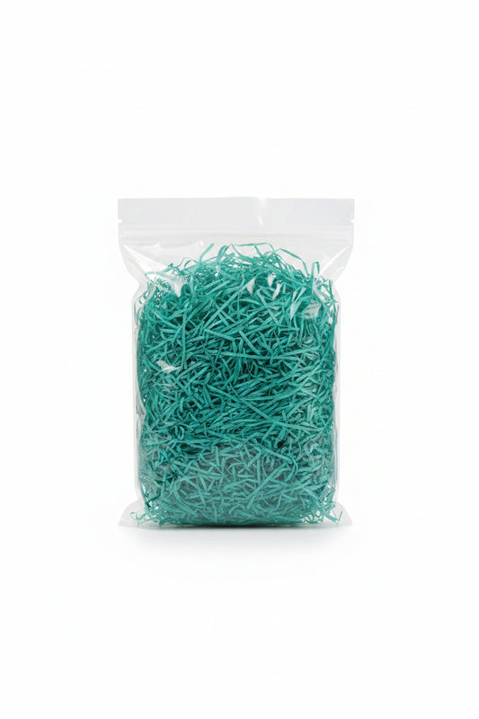 Teal turquoise shredded wooden gift box filler in a clear bag