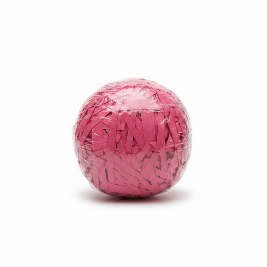 Hot pink magenta shredded paper gift box filler in a clear bag