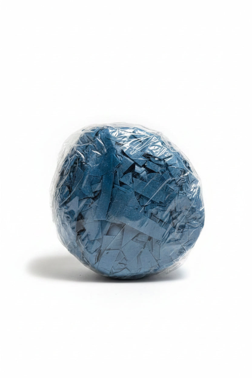 Dark denim blue shredded paper gift box filler in a clear bag