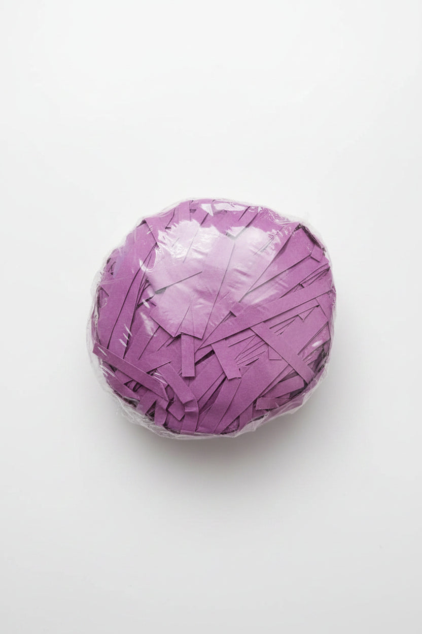 Purple violet shredded paper gift box filler in a clear bag