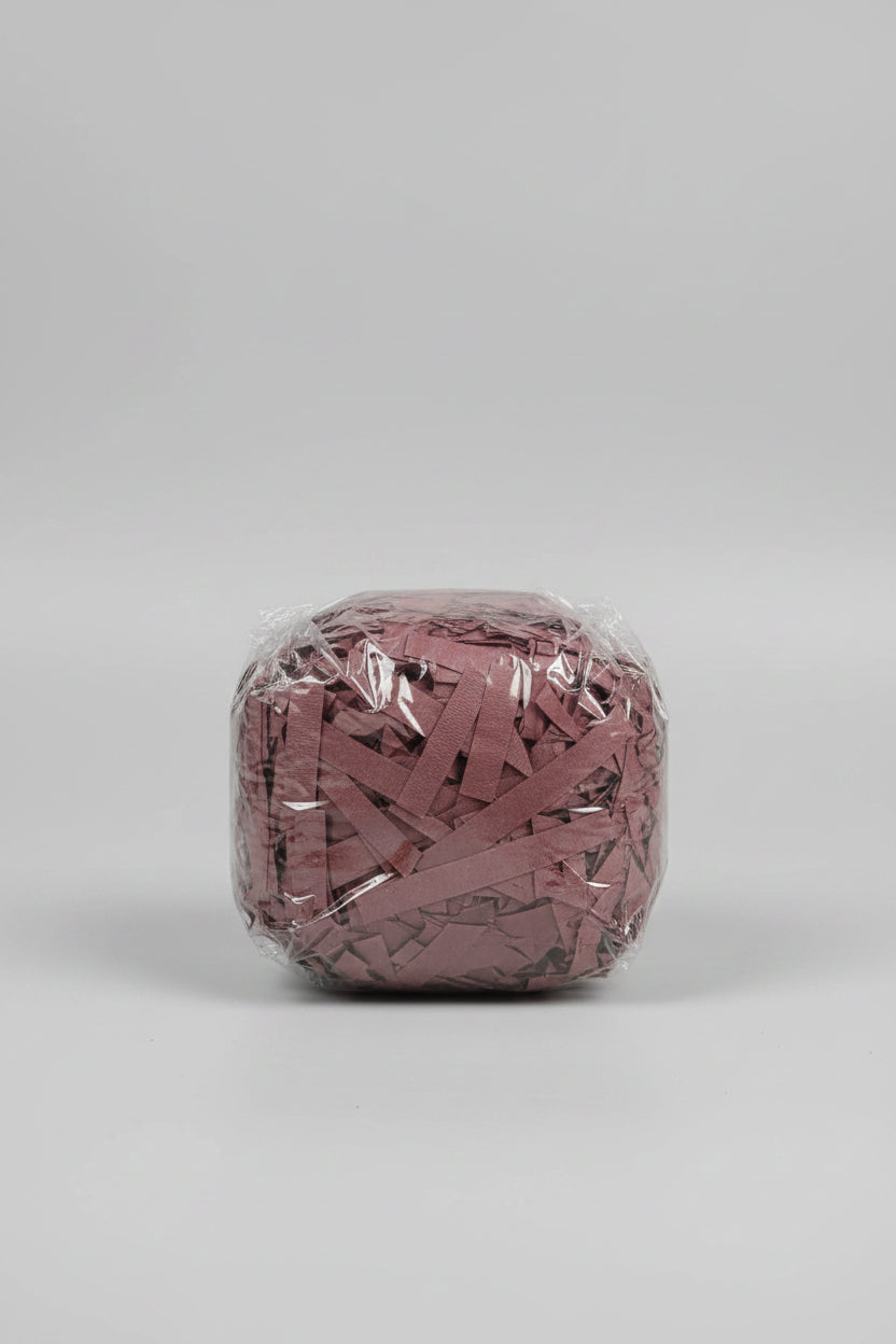 Mauve dusty rose shredded paper gift box filler in a clear bag
