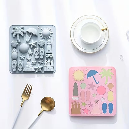 Grey and pink beach silicone moulds side by side with teacup and cutlery for scale