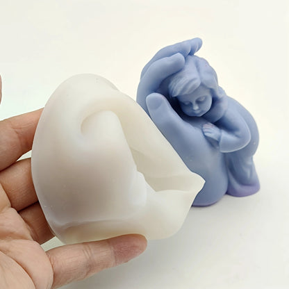Baby in hand silicone mold — finished resin ornament example