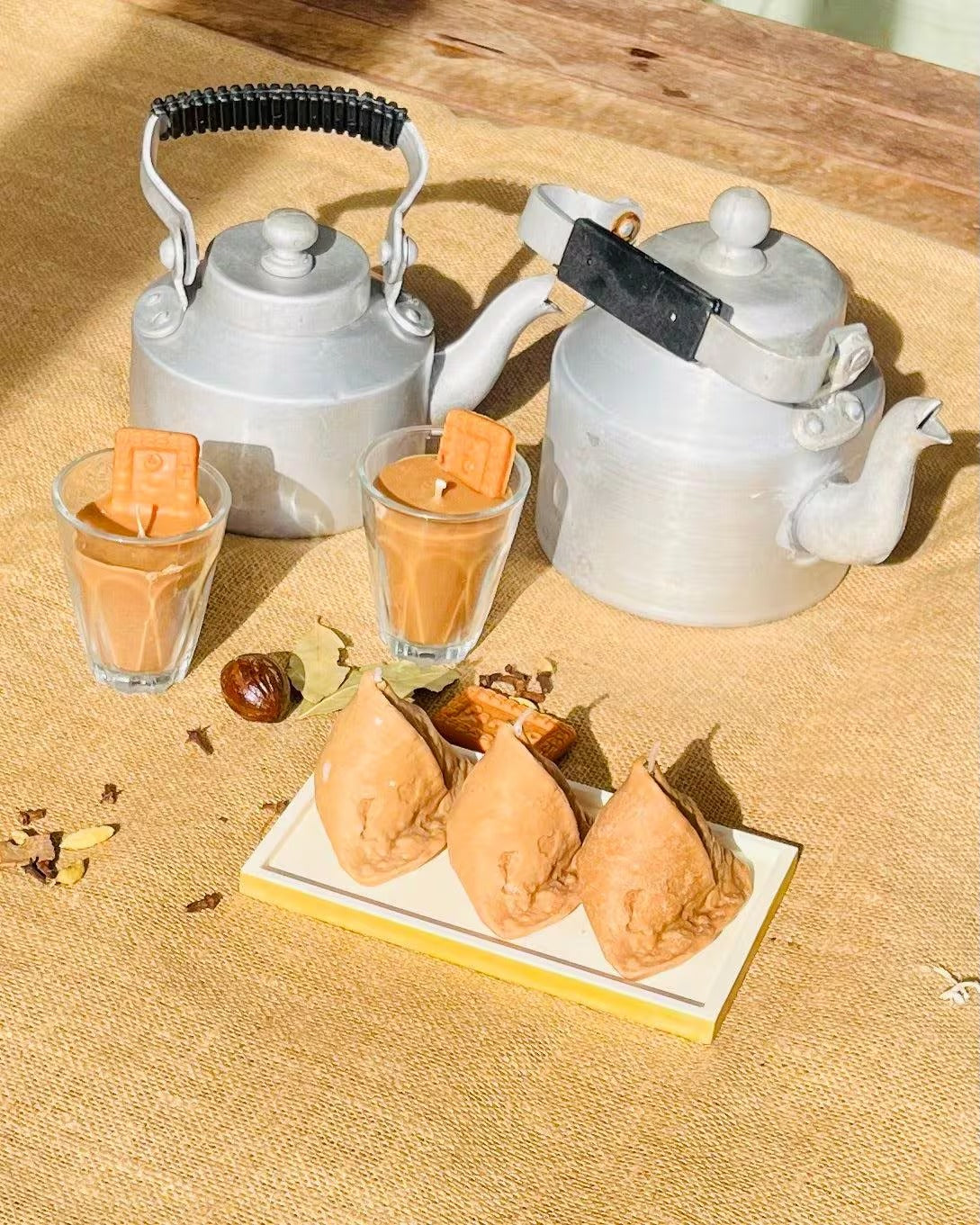 Golden samosa candle with realistic crimped pastry folds and triangular shape