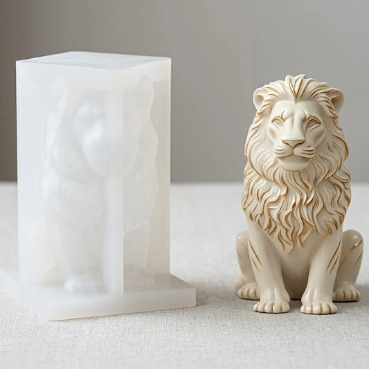 Seated lion candle mould beside a finished lion sample with a flowing mane and gold-coloured accents