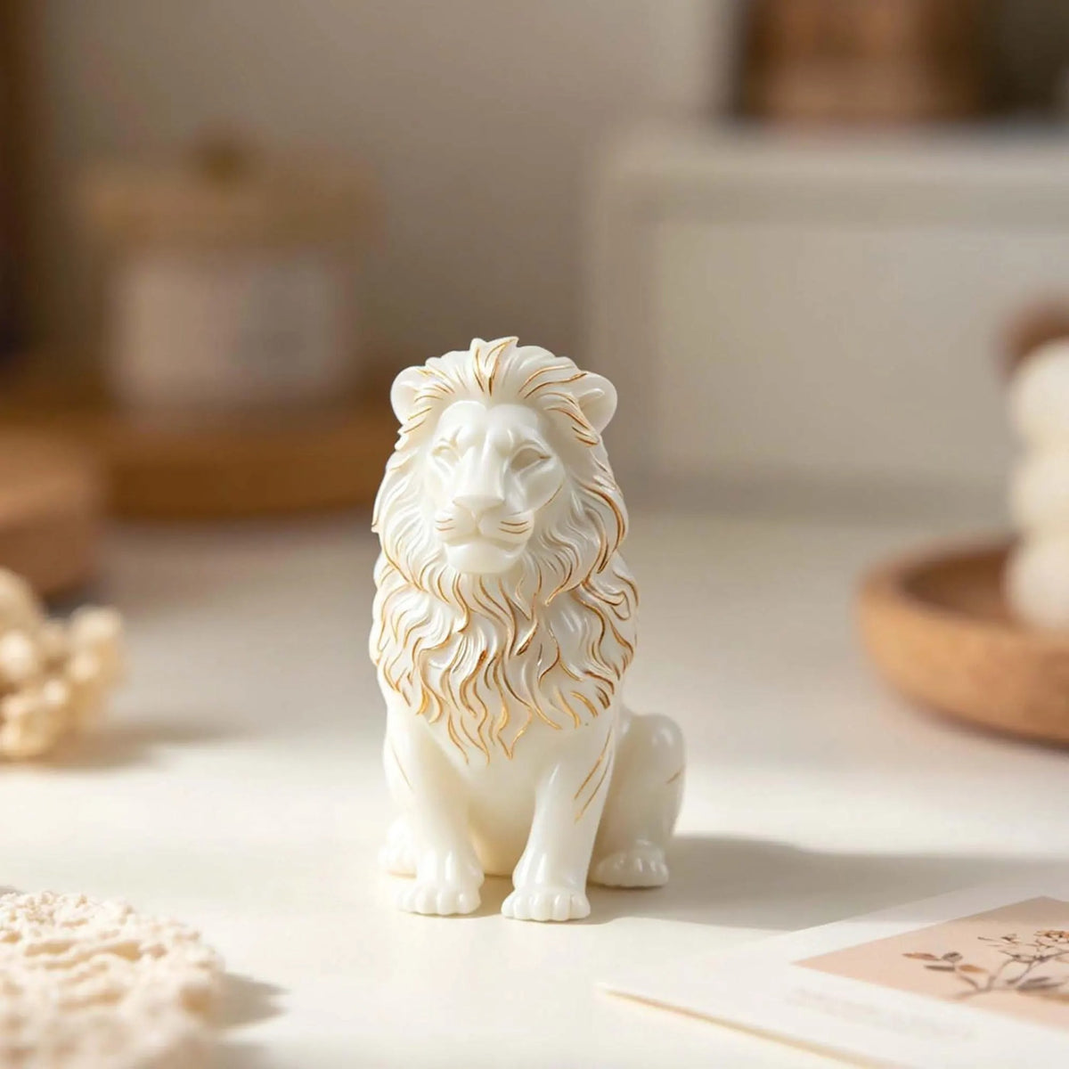 Front view of a seated lion sample casting with a detailed mane and paws