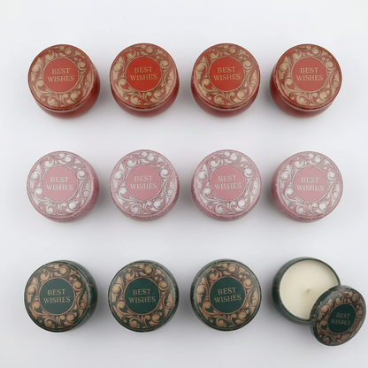 Best Wishes candle tins flat lay on white marble