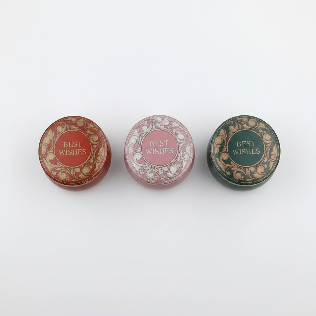 Best Wishes candle tins studio shot all three variants in a row