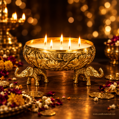 Gold elephant urli candle vessel with glowing multi-wick candle, dark moody background with golden bokeh
