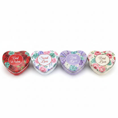 All 4 floral heart candle tin designs in a row on white studio background