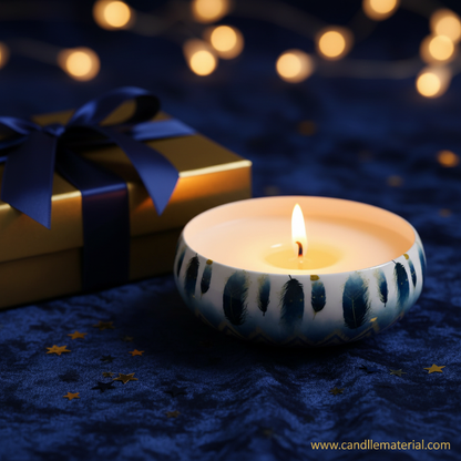 Blue feather candle bowl in festive gold and blue gift setup