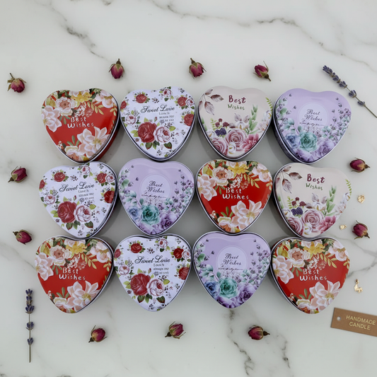 Floral heart candle tins grid flat lay on white marble with rose buds and gold leaf