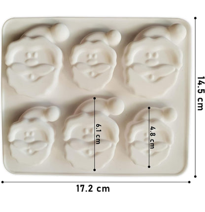 6-cavity Santa face silicone mold — finished candle example