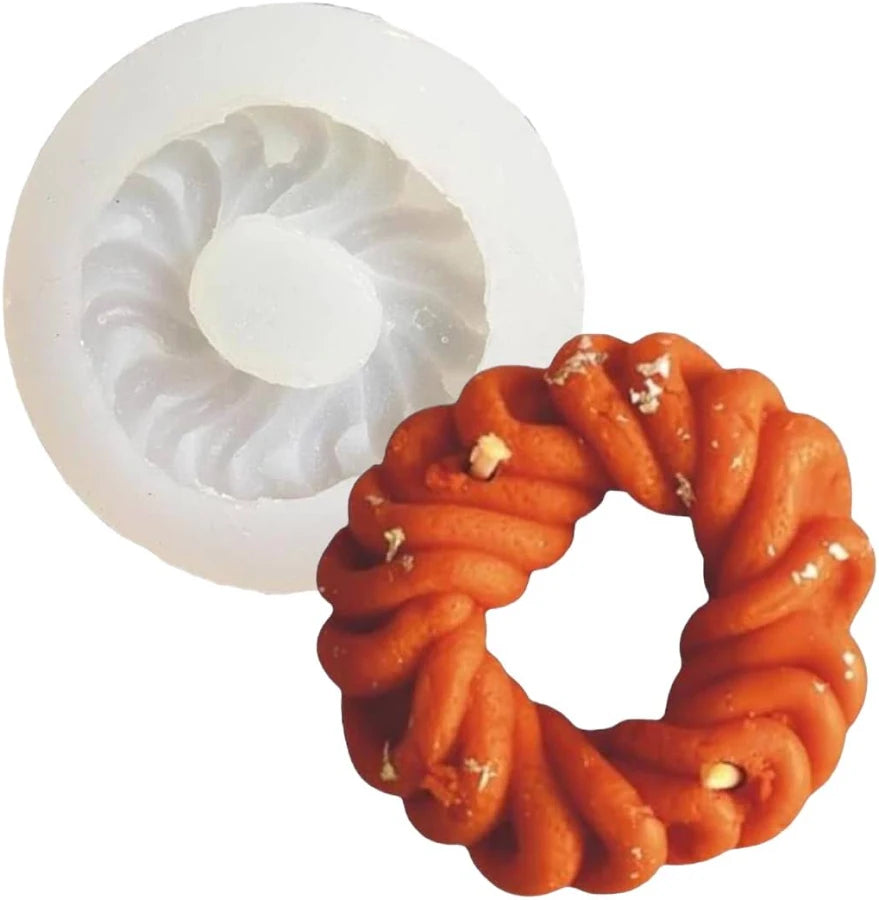 Imarti silicone mould with deep orange braided ring candle