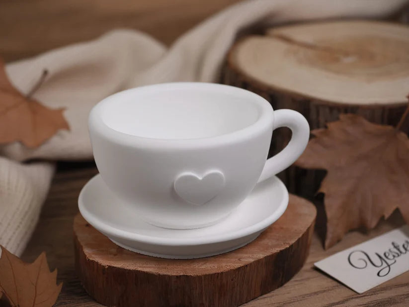 Heart Teacup and Saucer Silicone Candle Mould Set – finished white candle teacup with heart emboss on wooden display
