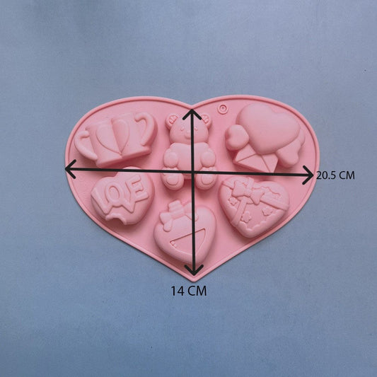Six white wax melts cast from Valentine love heart silicone mould showing all 6 cavity designs