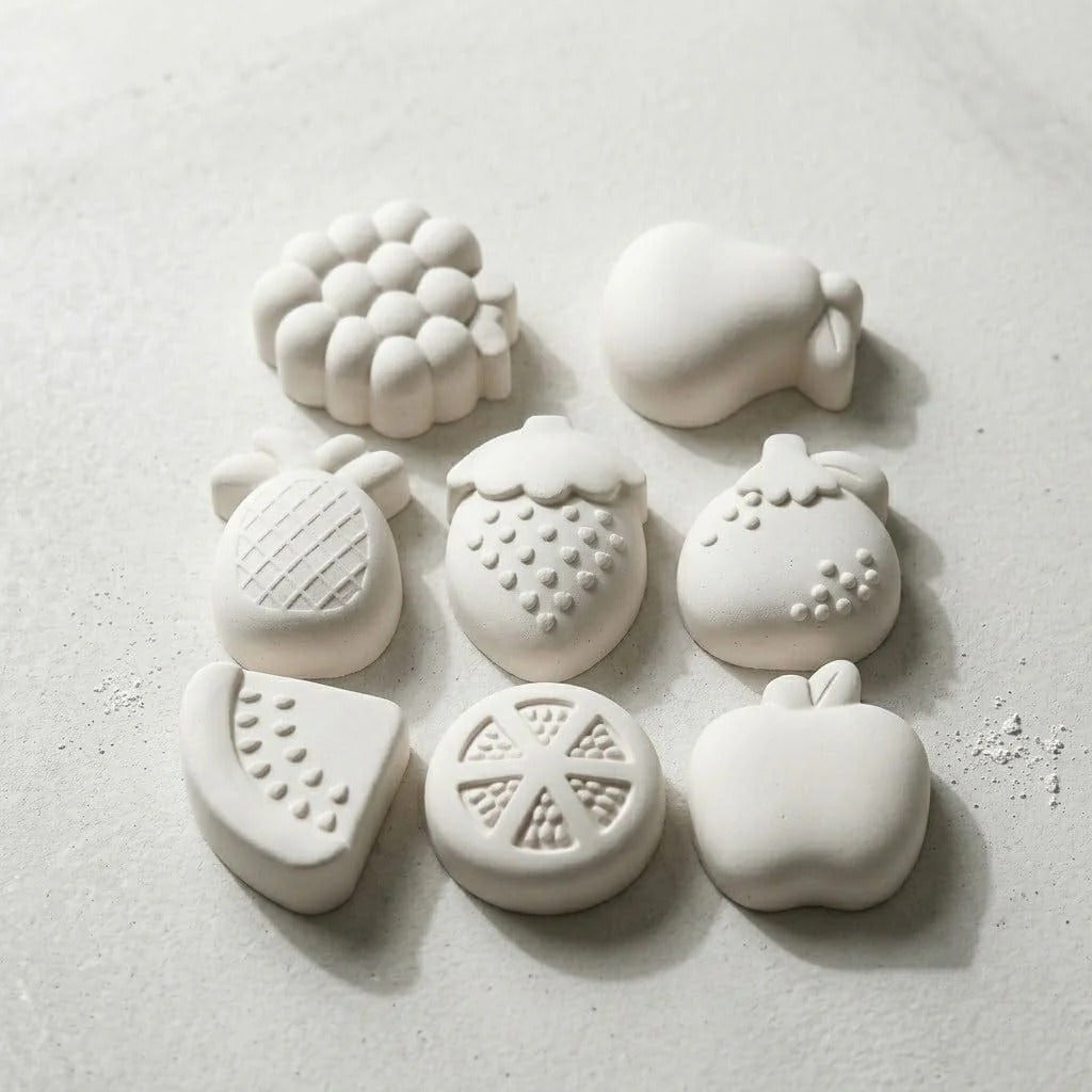 White wax melts cast from fruit silicone mould showing 8 fruit shapes