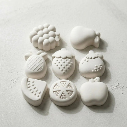 White wax melts cast from fruit silicone mould showing 8 fruit shapes