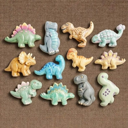 Colourful painted resin dinosaurs cast from mould including T-Rex, Stegosaurus, Triceratops and Brontosaurus